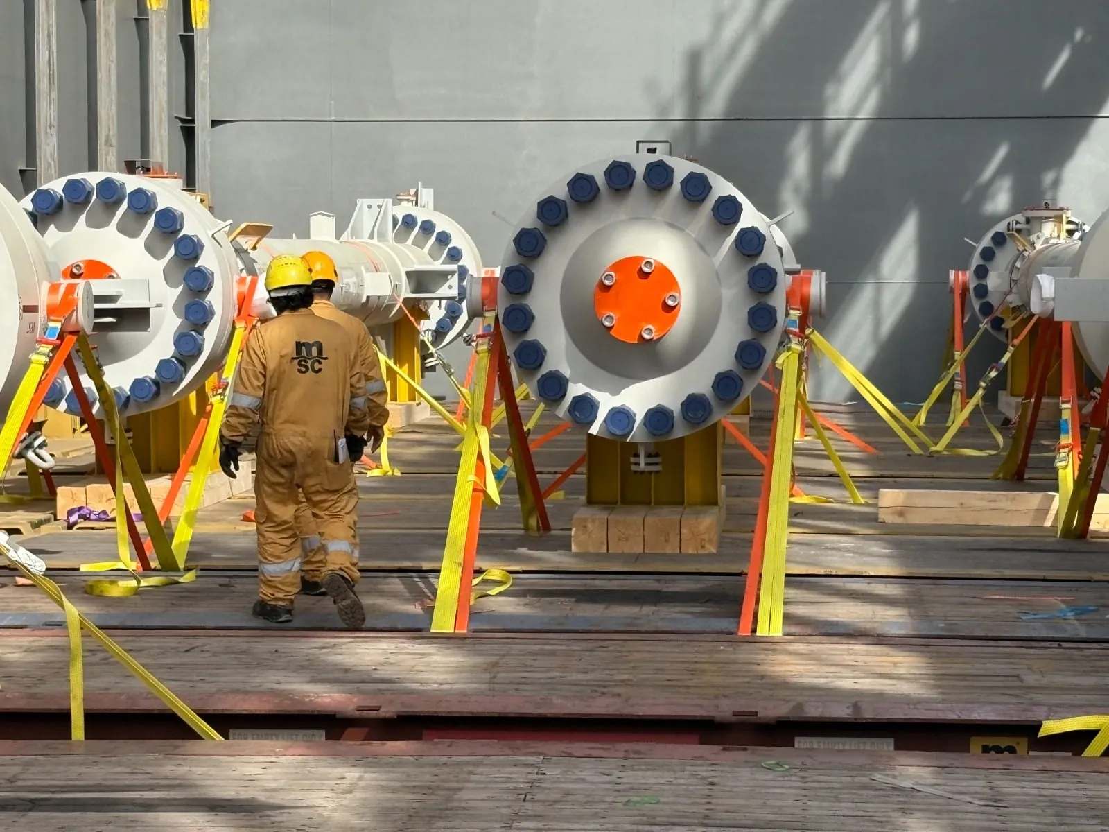 Flanged spool pieces lashed on a vessel deck